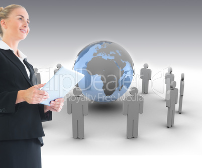 Composite image of businesswoman holding tablet