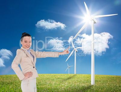 Composite image of smiling asian businesswoman pointing