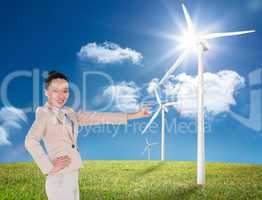 Composite image of smiling asian businesswoman pointing