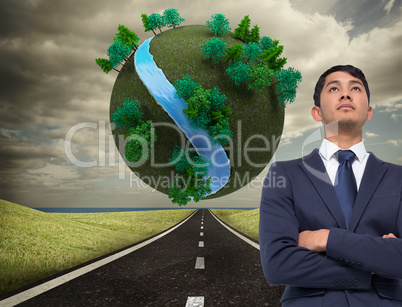 Composite image of unsmiling asian businessman with arms crossed