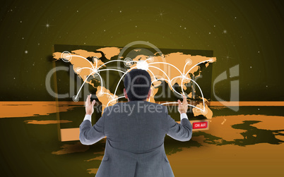 Composite image of businessman with arms raised