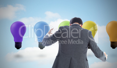 Composite image of businessman catching