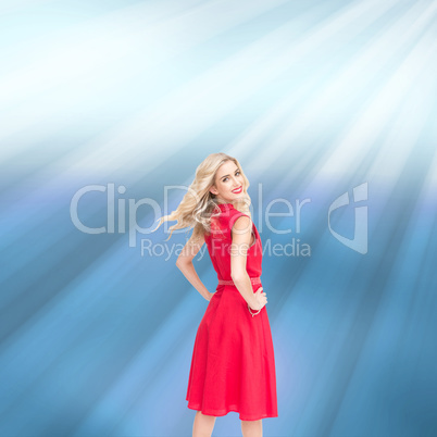 Composite image of smiling blonde turning