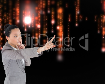 Composite image of unsmiling thinking asian businesswoman pointi