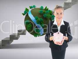 Composite image of businesswoman holding pink piggy bank