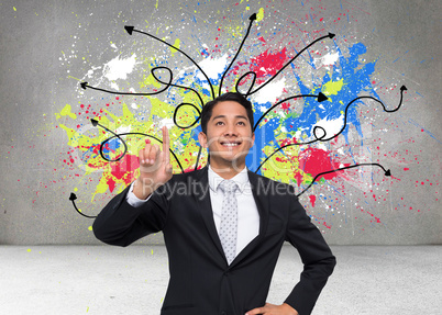 Composite image of smiling asian businessman pointing