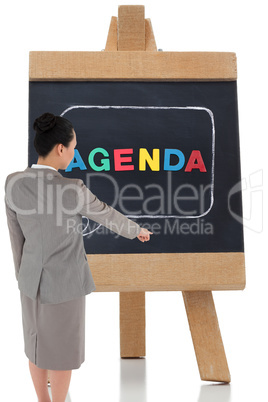 Composite image of asian businesswoman pointing