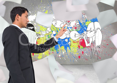 Composite image of serious asian businessman pointing