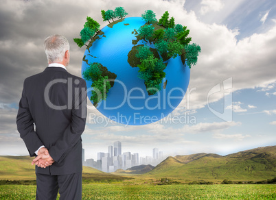 Composite image of rear view of mature businessman posing