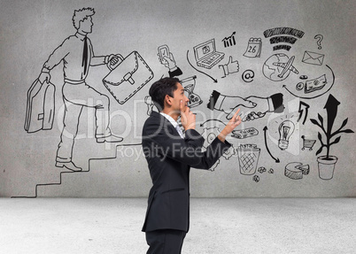 Composite image of thoughtful asian businessman pointing