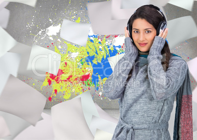 Composite image of beautiful model wearing winter clothes listen