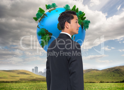 Composite image of serious asian businessman