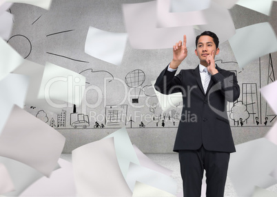 Composite image of thoughtful asian businessman pointing