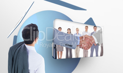 Composite image of businessman standing