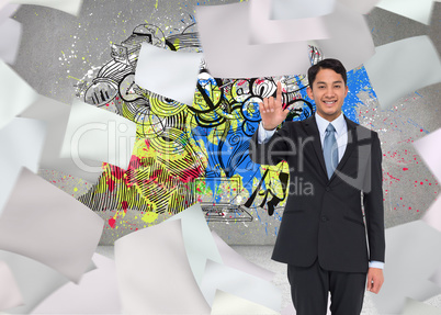 Composite image of smiling asian businessman pointing