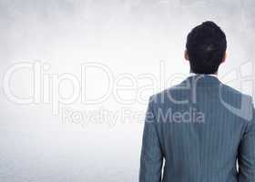 Composite image of businessman standing