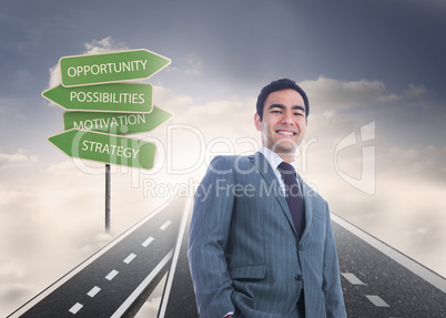 Composite image of smiling businessman standing