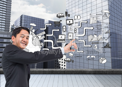 Composite image of smiling asian businessman pointing