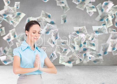 Composite image of peaceful young businesswoman praying