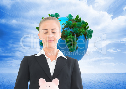 Composite image of businesswoman holding piggy bank