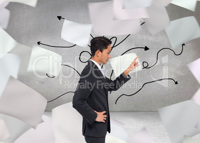 Composite image of unsmiling asian businessman pointing