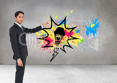 Composite image of serious asian businessman pointing