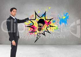 Composite image of serious asian businessman pointing