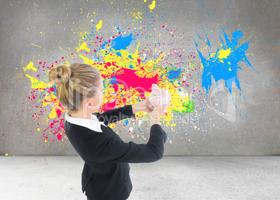 Composite image of businesswoman holding pink piggy bank