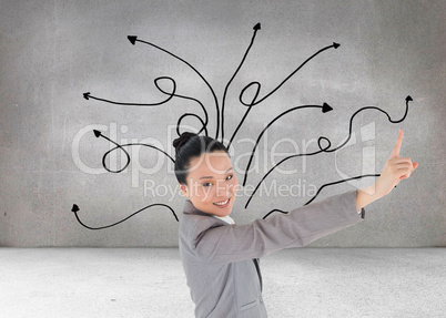 Composite image of smiling asian businesswoman pointing