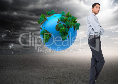 Composite image of serious asian businessman