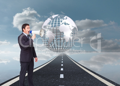 Composite image of standing businessman shouting through a megap