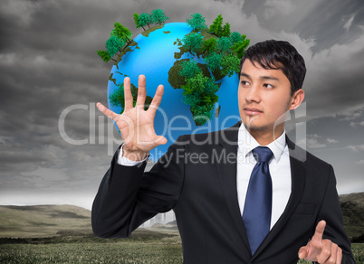 Composite image of unsmiling businessman holding and pointing