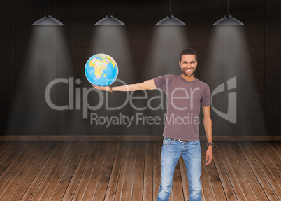 Composite image of handsome man holding out a globe