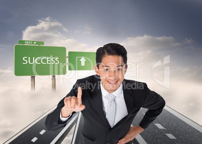 Composite image of smiling asian businessman pointing