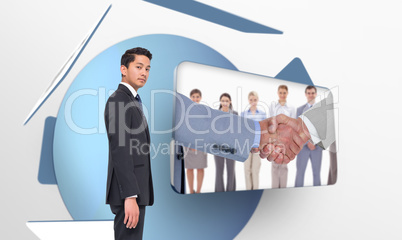 Composite image of unsmiling businessman looking at camera