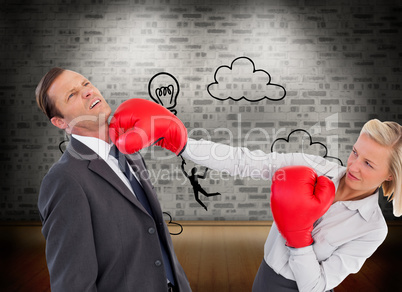 Composite image of businesswoman hitting colleague with her boxi