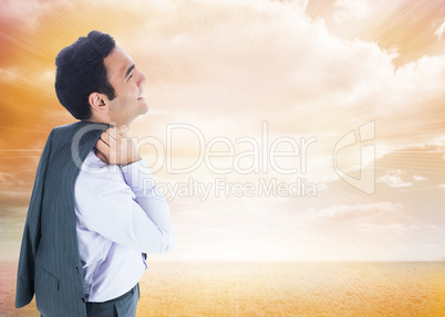 Composite image of smiling businessman standing