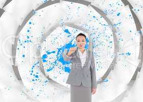 Composite image of unsmiling asian businesswoman pointing