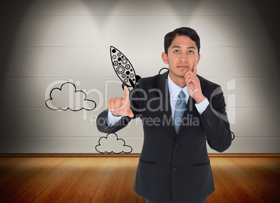 Composite image of thoughtful asian businessman pointing