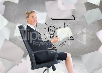 Composite image of businesswoman sitting in swivel chair holding