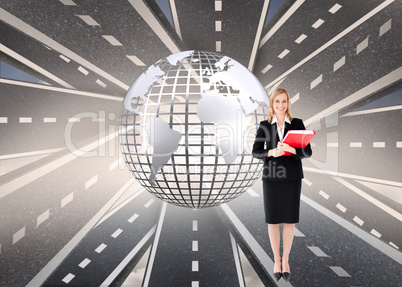 Composite image of businesswoman smiling and holding folders