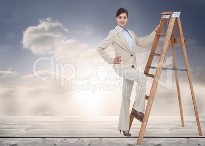 Composite image of smiling businesswoman climbing the career lad