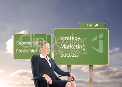 Composite image of businesswoman sitting on swivel chair in blac