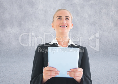 Composite image of businesswoman holding tablet