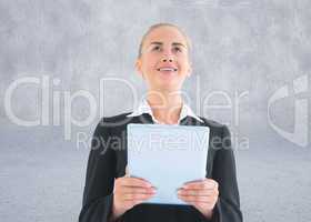 Composite image of businesswoman holding tablet