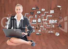 Composite image of businesswoman using laptop