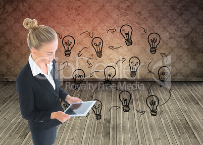 Composite image of businesswoman holding new tablet