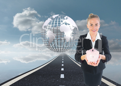 Composite image of businesswoman holding pink piggy bank