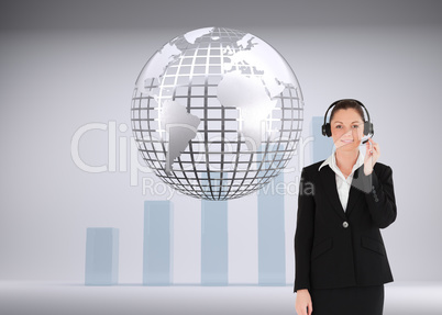 Composite image of good looking woman in suit using headphones a