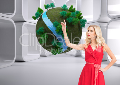 Composite image of elegant blonde standing pointing